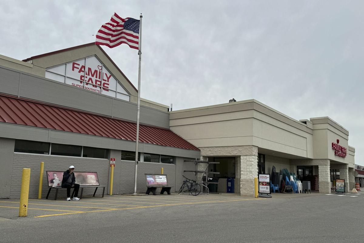 Woman was living inside rooftop grocery store sign with computer and