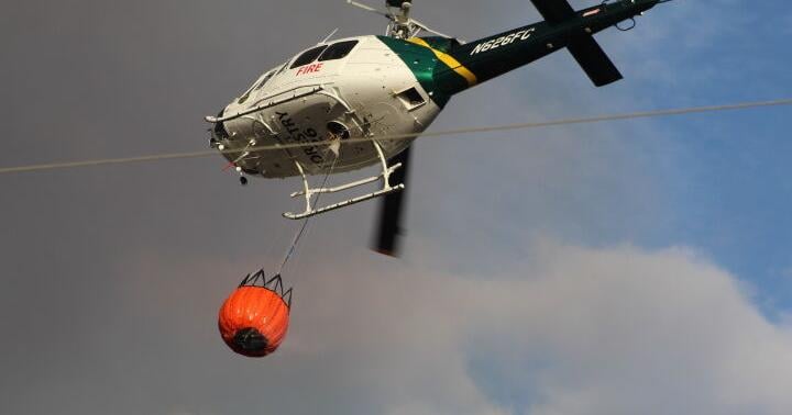 Brush trucks, helicopter key to halting fire