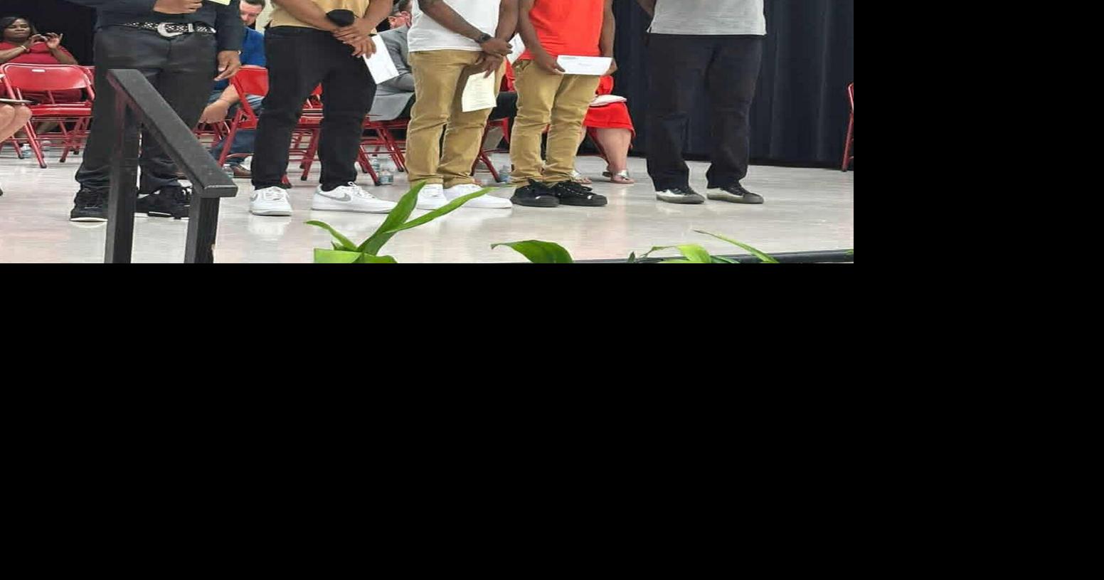 Men of Standards help 4 students with scholarships