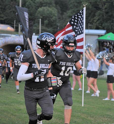 TugER Riley Damron and Buddy Marcum carry flag.jpg
