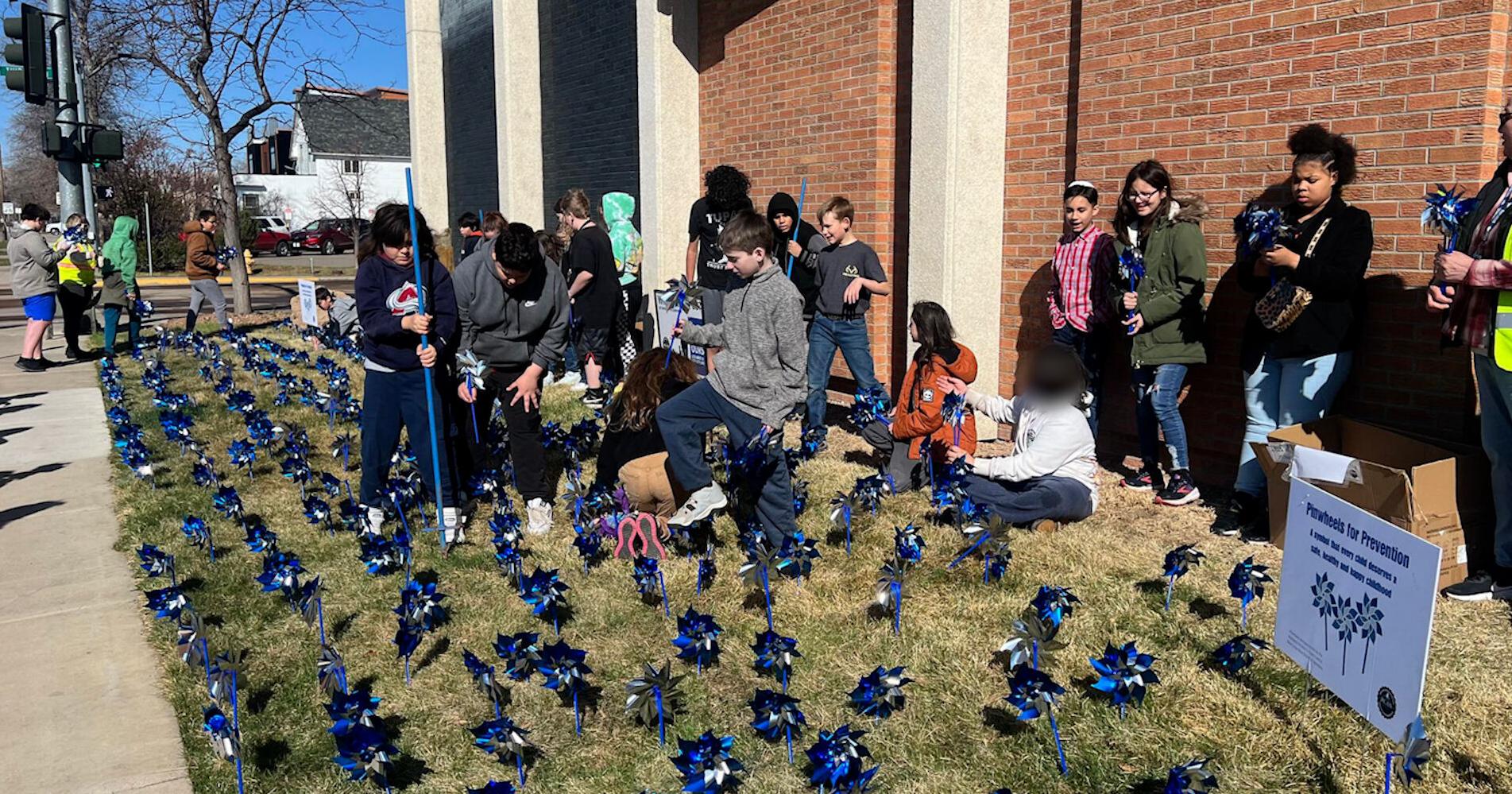 Students plant blue pinwheels to kick off NoMore Violence Week in Great Falls - Vimarsana News