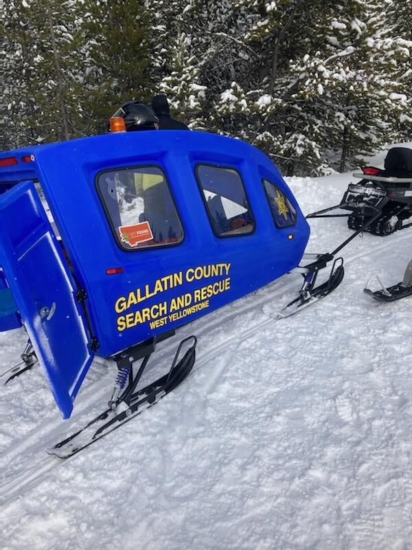 Search and rescue helps transport woman who was injured in a snowmobile