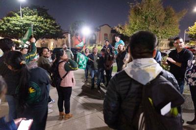 Dozens of residents celebrate outside of Salinas City Hal