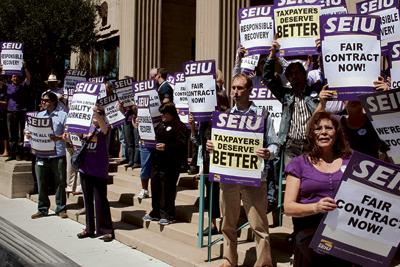 County workers ask supes to slash management perks.