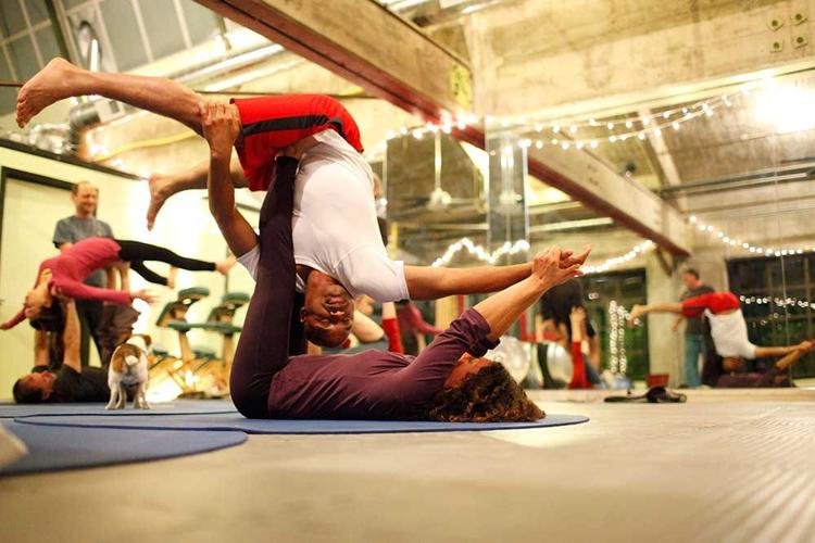 Evolution Transformative Arts teaches a dynamic – and acrobatic – form of yoga.