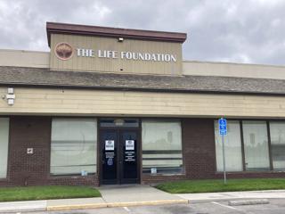 County and Life Foundation move toward a settlement in hope of closing a deal on a Social Services building.