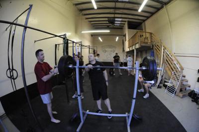 Fitness freaks brace for impact as popular CrossFit empire fights off a possible buyout.  