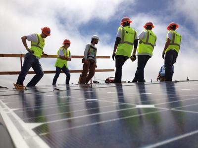 SunEdison, GRID Alternatives and volunteers install solar panels