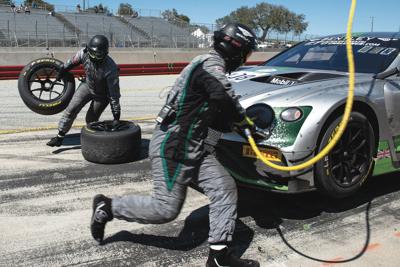 A pit crew balances anxious moments and dull routine during the California 8 Hours.