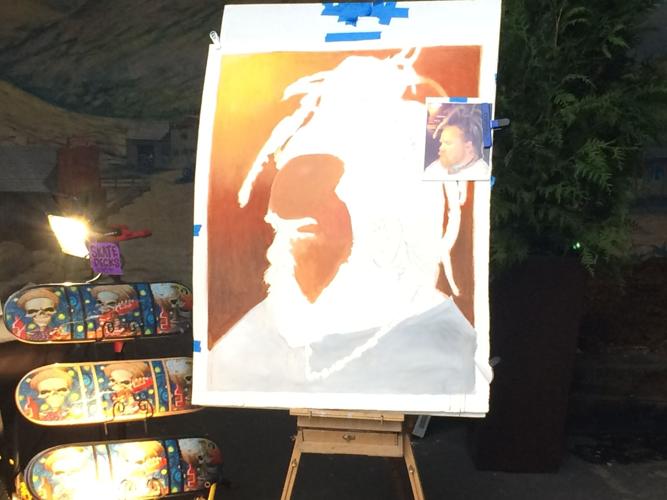 Live painter Kirk O' Hara, aka Paintmouth, worked on a self-portrait.