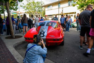 People pack Alvarado Street in Monterey during the Car Week