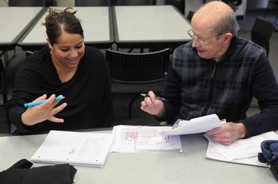 Taking food orders and reading Darwin, English learners at the local library evolve with oomph.  
