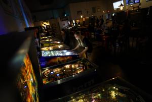 Image for display with article titled A Community of Gamers Join Together for Pinball and Camaraderie.