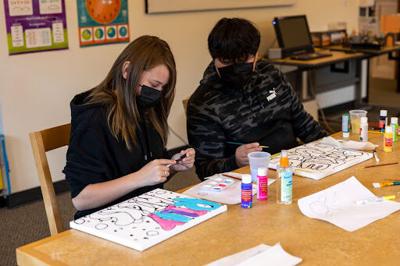 Riley Hicks,13, and Jose Herrera, 13, attended the graffiti art workshop at the Marina Library