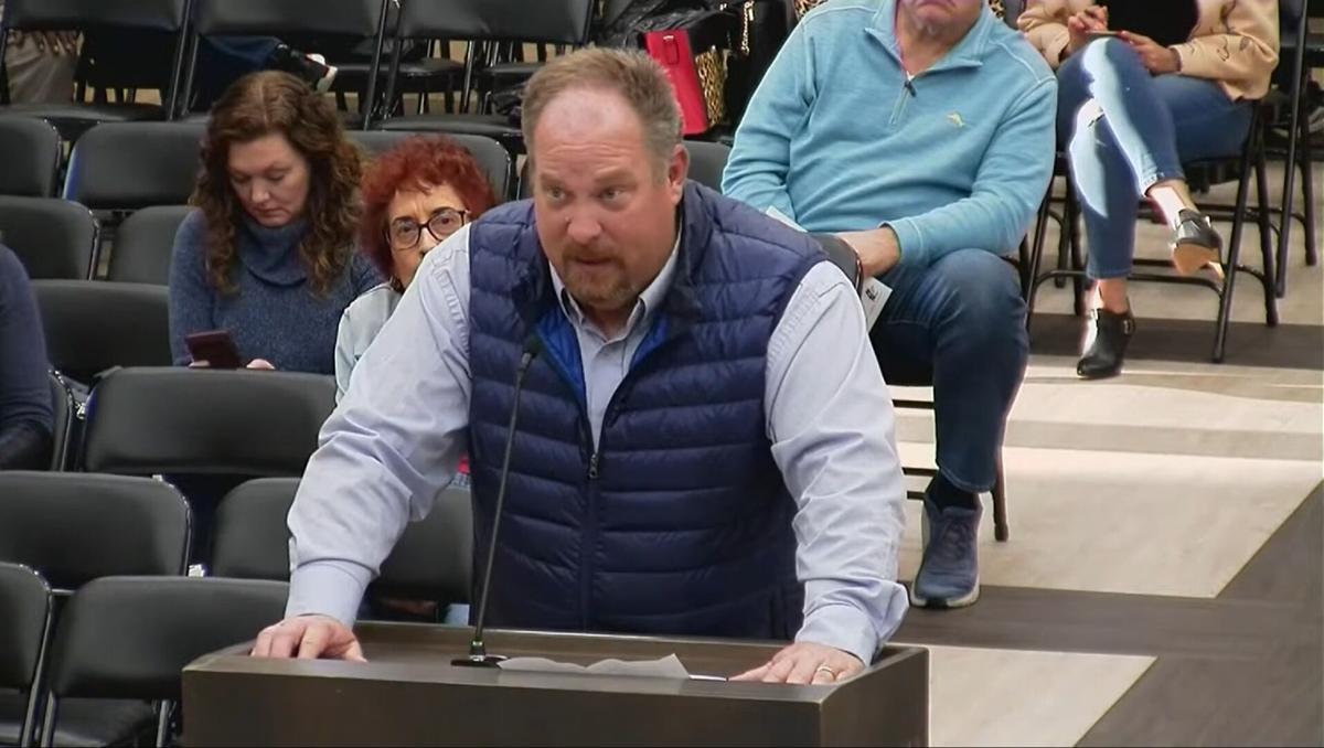 Principal Bryan Paslay of Troutman Middle School addresses the Iredell-Statesville Board of Education meeting in Statesville on Monday.