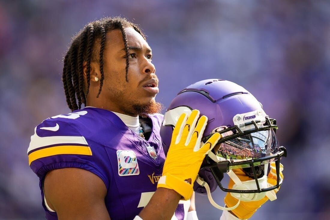 A Minnesota Vikings fan cheers during the opening ceremonies of an