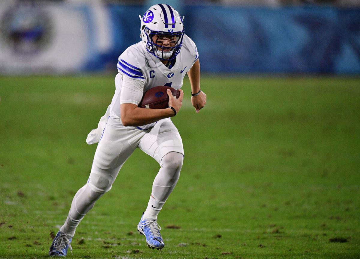 Brigham Young quarterback Zach Wilson runs for a touchdown in the first half against Central Florida at FAU Stadium in Boca Raton, Florida, on Tuesday, Dec. 22, 2020.