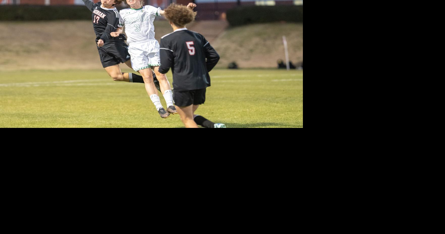REGION CHAMPS County High School Soccer Dogs win battle for