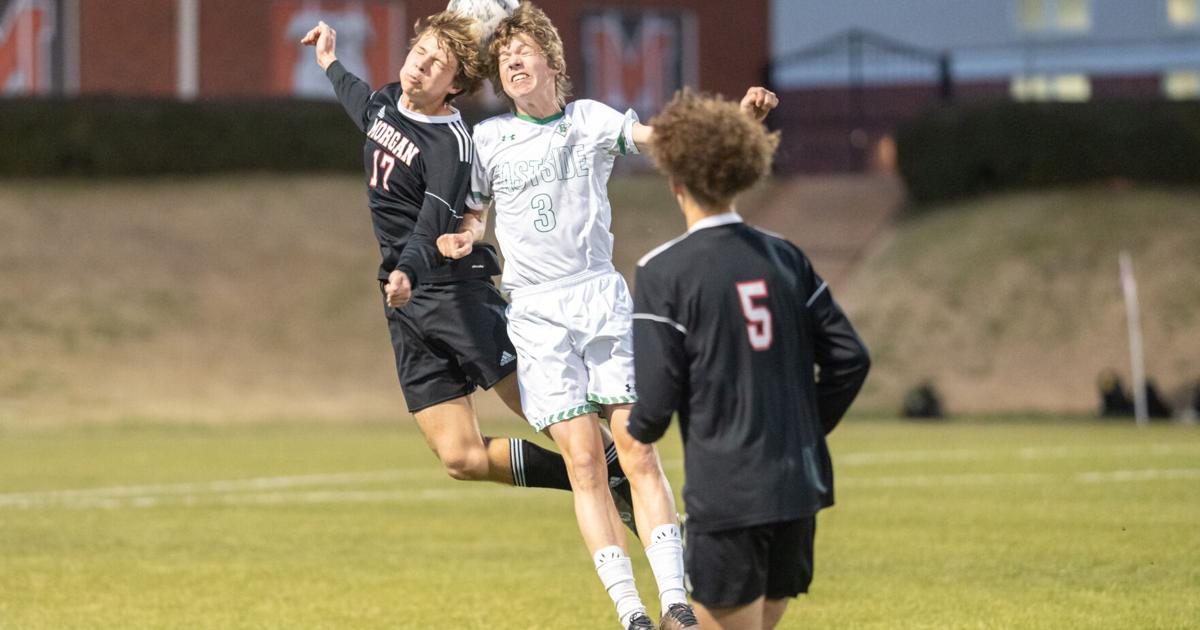 REGION CHAMPS County High School Soccer Dogs win battle for