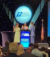 GMA swears in Perriman, appoints Reid to training board, Madison unveils new flag at annual Savannah conference
