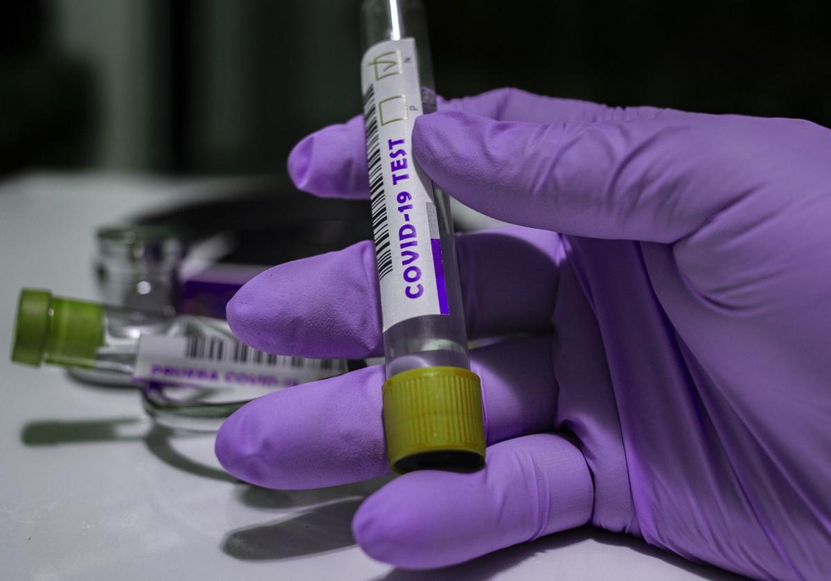 covid-19 test tube in hand