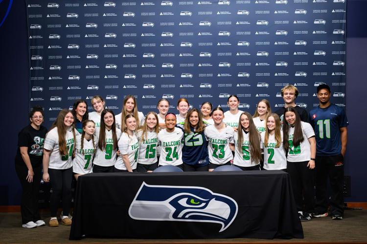 The Woodinville High School girls flag football team celebrated the sport being sanctioned by the WIAA in an event held by the Seahawks at the Virginia Mason Athletic Center Thursday, April 24, 2025.