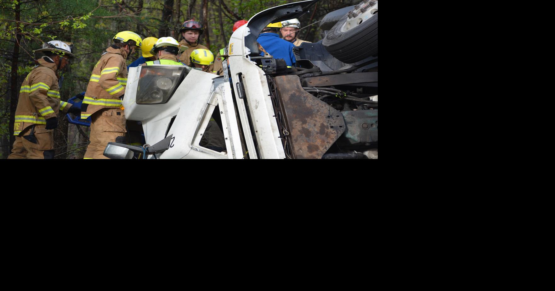 Driver airlifted after being trapped in truck