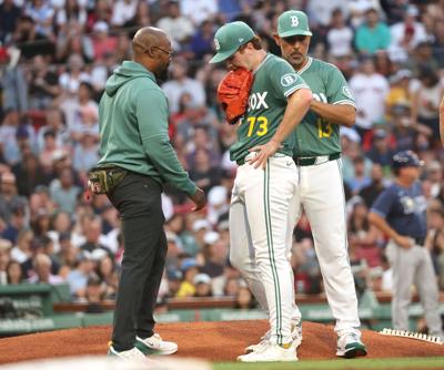 Boston Red Sox pitcher Hunter Dobbins is removed from the game after an injury in the second inning against the Tampa Bay Rays at Fenway Park on July 11, 2025, in Boston.