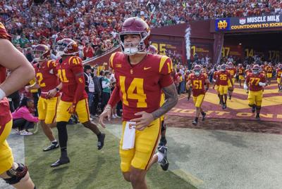 USC Trojans quarterback Jayden Maiava runs out to the field with his teammates against Notre Dame at the LA Coliseum on Nov. 30, 2024, in Los Angeles,.