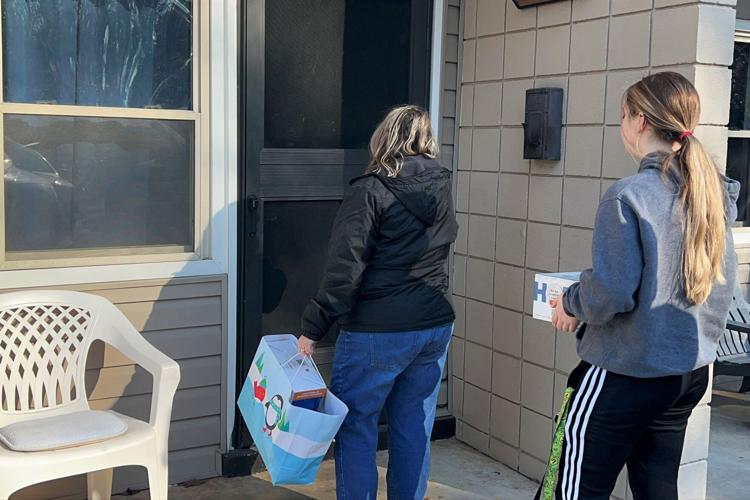 Housing Authority passes out gifts, food boxes for seniors