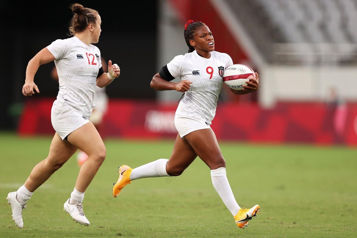 The United States' Kristi Kirshe looks on as teammate Ariana Ramsey breaks away to score a try in the a pool match against Japan during the Rugby Sevens on Day 6 of the Tokyo 2020 Olympic Games at Tokyo Stadium on July 29, 2021, in Chofu, Tokyo, Japan.