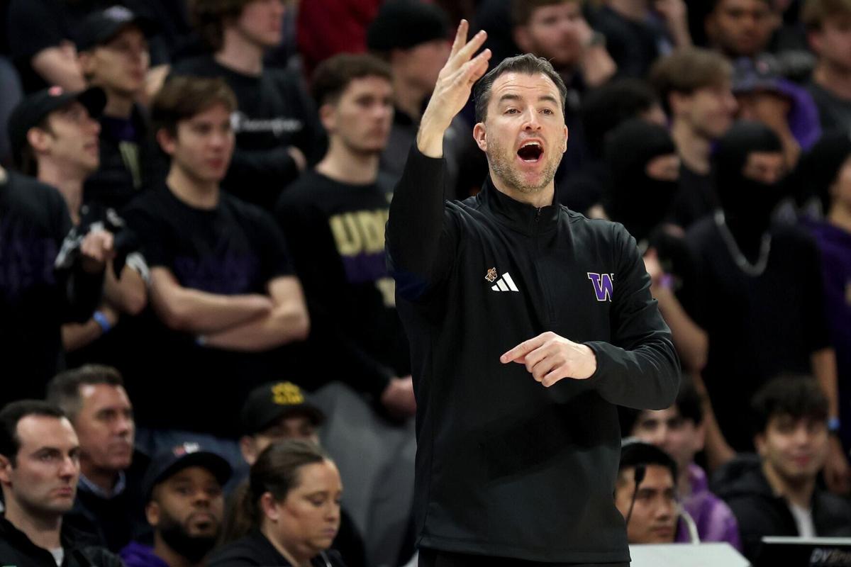 Washington head coach Danny Sprinkle reacts during the first half against Washington State at Alaska Airlines Arena on Dec. 18, 2024, in Seattle.