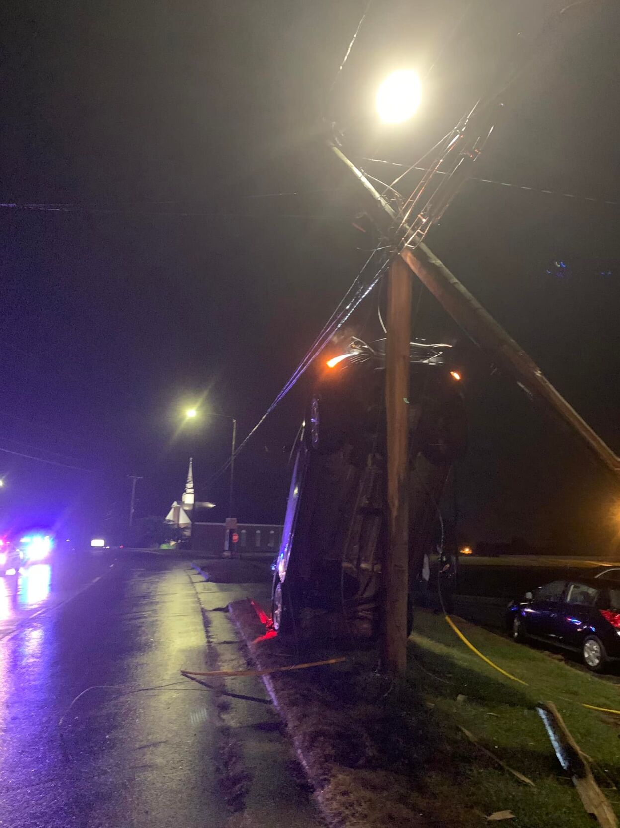 Man charged after car jumps curb, slams into utility pole