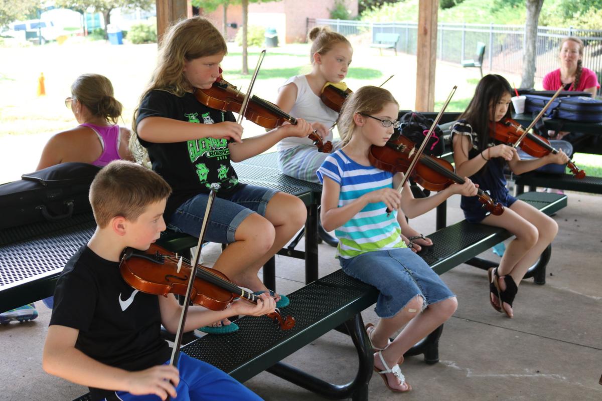 Fiddle students fill Martha’s Park with music