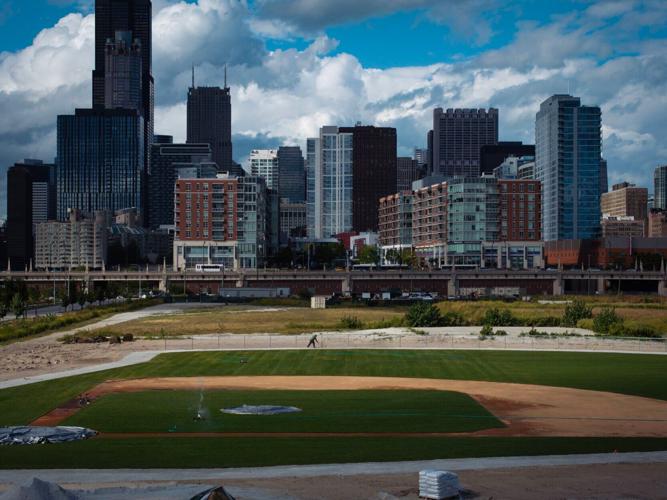 A goundskeeper tends to a baseball field that has arisen on the 78, where a new Chicago White Sox stadium has been proposed, Friday, Sep. 6, 2024, in Chicago.