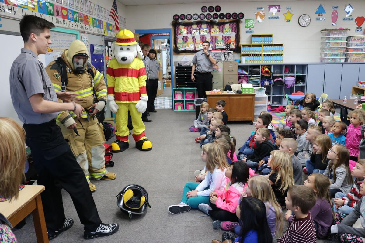 Firefighting students teach kindergartners fire safety