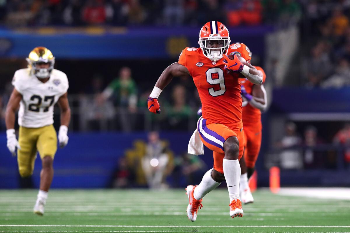 Travis Etienne of the Clemson Tigers runs for a 62- yard touchdown in the third quarter against the Notre Dame Fighting Irish during the College Football Playoff Semifinal Goodyear Cotton Bowl Classic at AT&T Stadium on December 29, 2018 in Arlington, Texas.