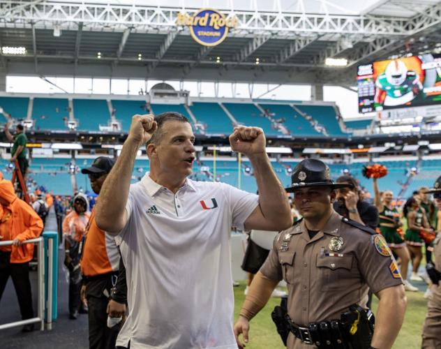 Miami Hurricanes head coach Mario Cristobal celebrates with fans after their win over the Duke Blue Devils during an ACC football game at Hard Rock Stadium on Saturday, Nov. 2, 2024, in Miami Gardens, Florida.