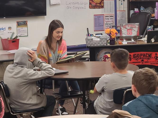 East Burke girls basketball team takes time to give back amid playoff run