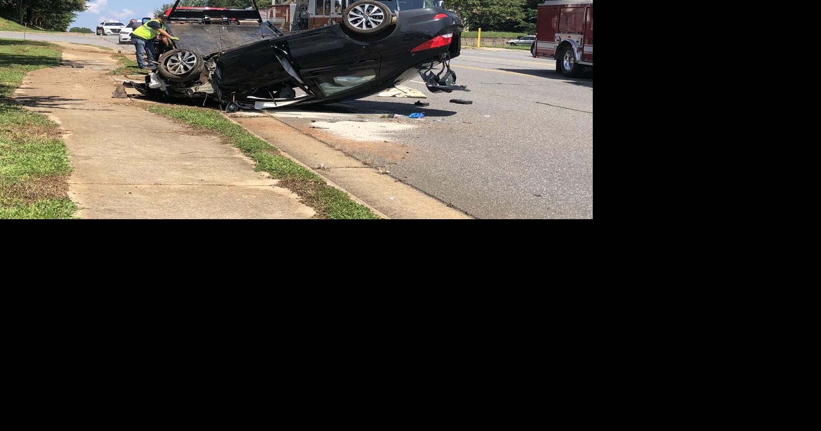 One injured after car flips, catches on fire