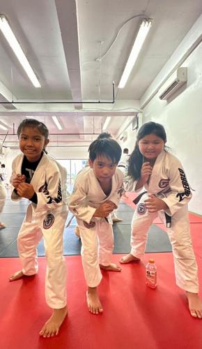 Aiyani Rios, Deighton Muna and Jacqueline Quitugua pose for a photo. They are three of the seven members of the NMI's Trench Tech Purebred team that will be compete in the 2024 Patgon Jiu Jitsu Tournament  on April 27 at the UOG Calvo Field House in Man...