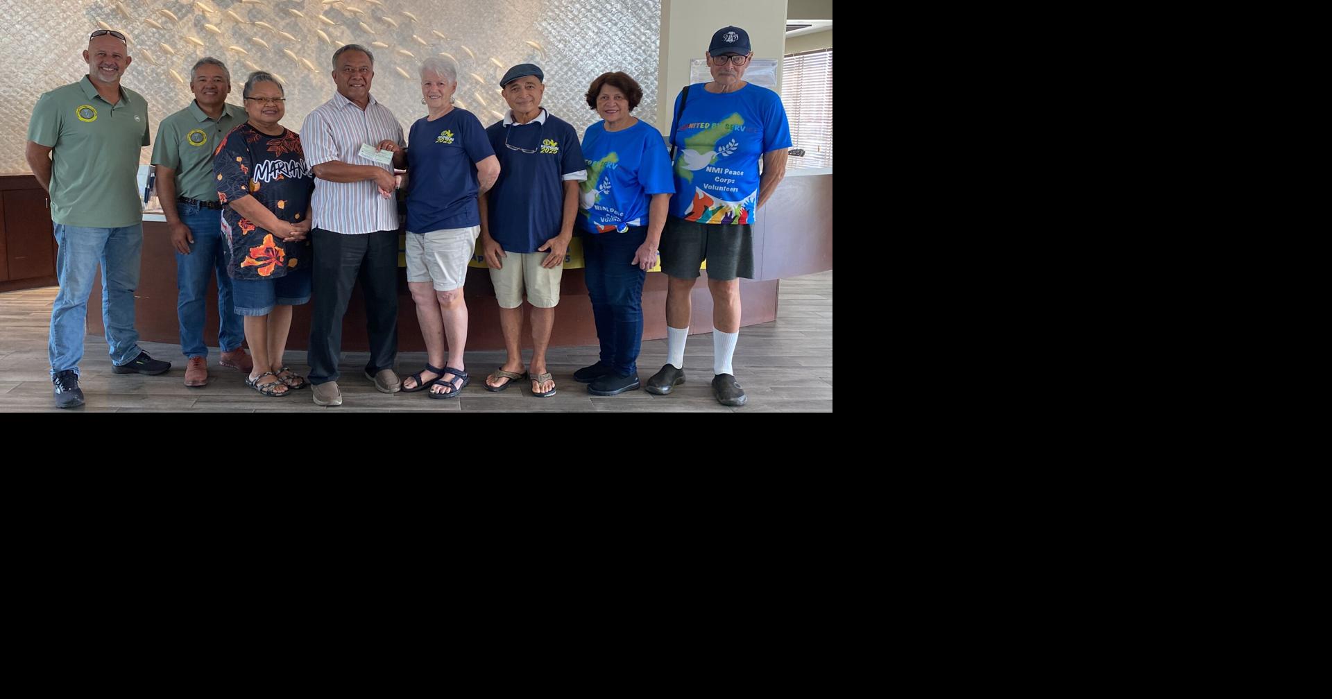 Peace Corps volunteers make monetary donations to NMASA and Humanities Council