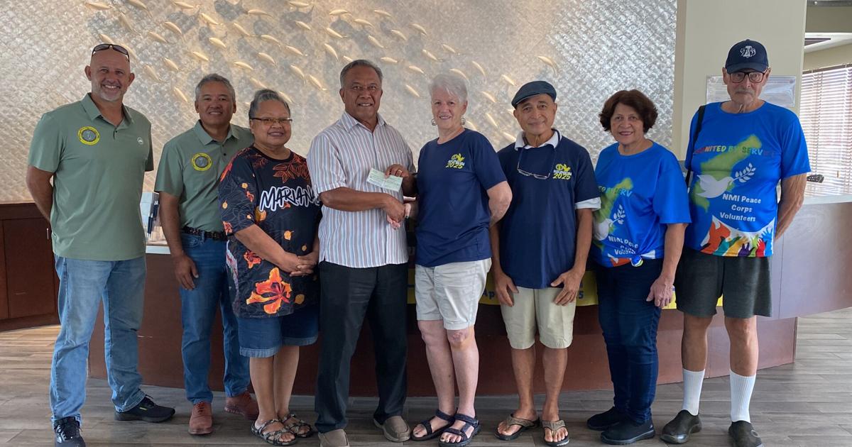 Peace Corps volunteers make monetary donations to NMASA and Humanities Council