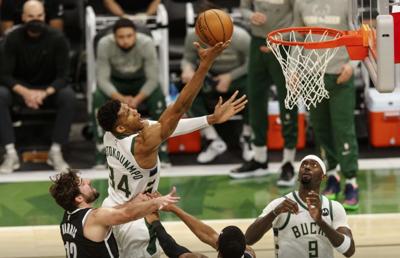 photo Kyrie Irving Injury Giannis nets as kyrie irving injured