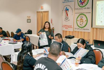 CNMI Council on Developmental Disabilities Assistive Technology Program Manager Jo Tudela conducts a training session for first responders.