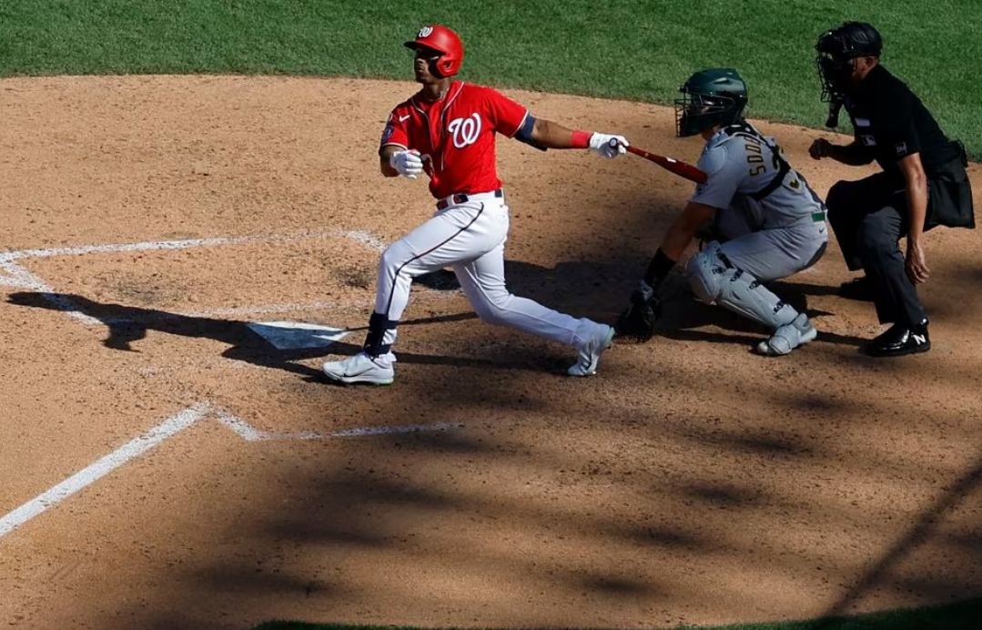 Nationals rally with 4-run ninth to edge Rockies