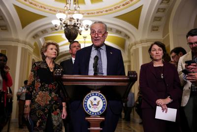 Democrat Senators address reporters following their weekly lunch at the U.S. Capital in Washington.
