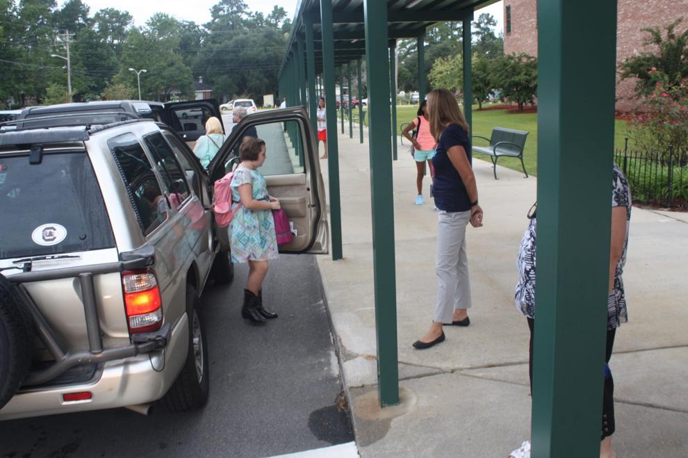 Students arriving at Conway Middle School for the first day of classes
