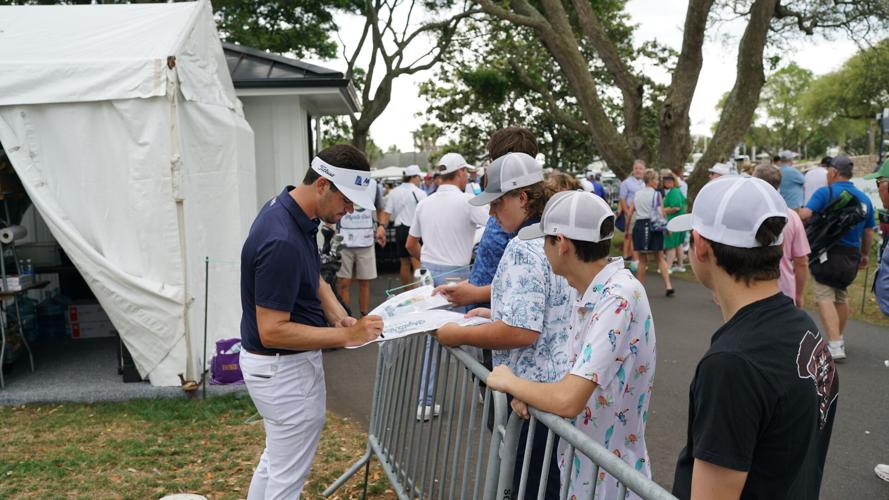 Hossler signs autographs