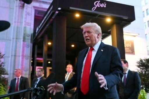 US President Donald Trump speaks to reporters outside the restaurant Joe’s Seafood, Prime Steak & Stone Crab in Washington, DC